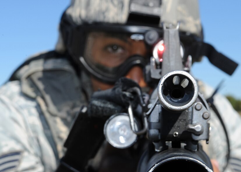 BARKSDALE AIR FORCE BASE, La. -- Senior Airman Lazarus Wallace, 2nd Security Forces Squadron, takes aim at a target during a training exercise for the Global Strike Challenge Nov. 4.The 2 SFS will be competing in a four-day competition in hopes of claiming the charlie fire team trophy. (U.S. Air Force photo/2nd Lieutenant Victoria Lalich)(Released)