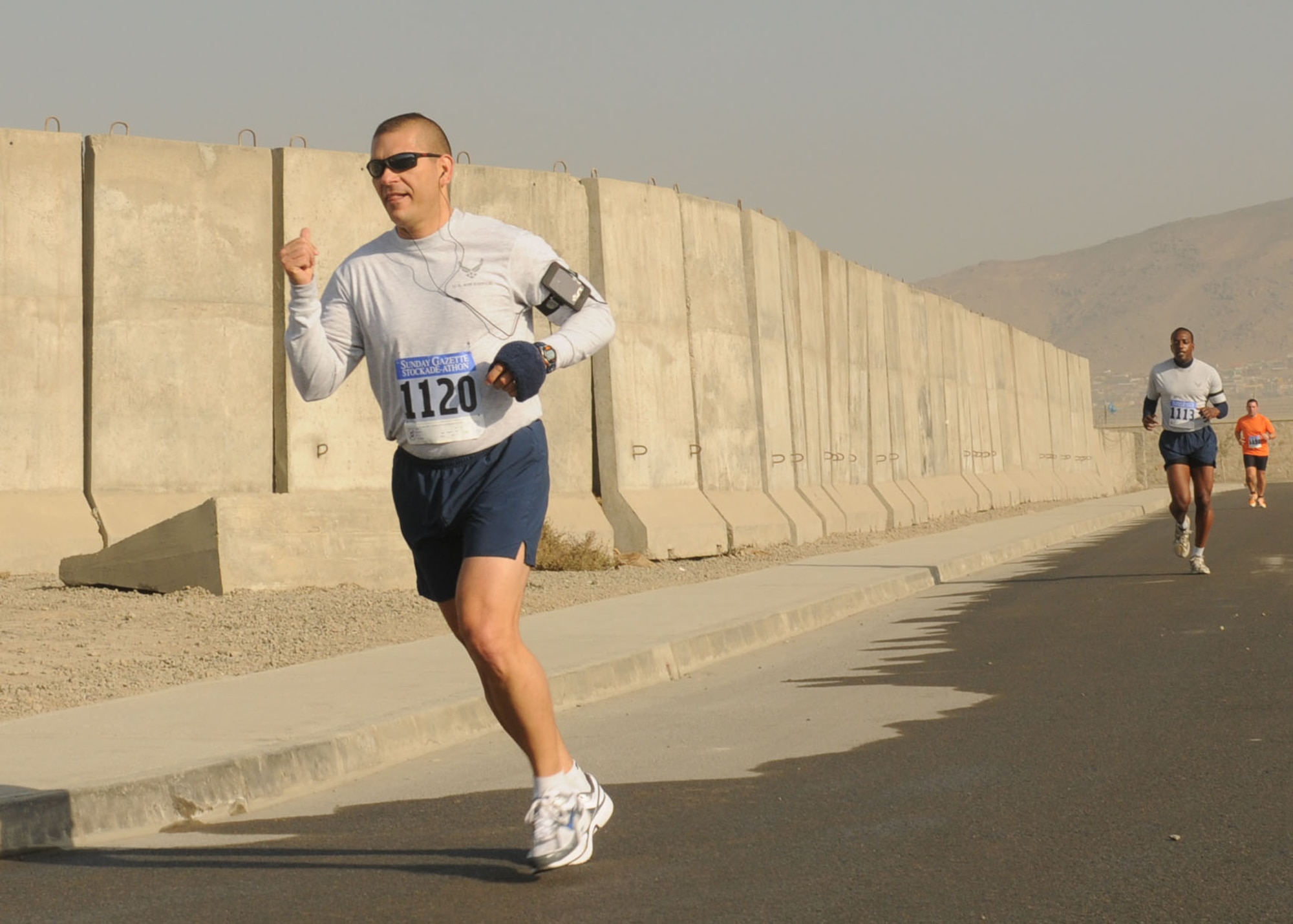 101105-N-6541W-032 KABUL, Afghanistan - Members of NATO Training Mission - Afghanistan and Afghan Air Force members run the 15k Stockade-athon at Kabul, Afghanistan on Nov.5th. (U.S. Navy photo by Mass Communication Specialist 3rd Class Jared Walker/ RELEASED).