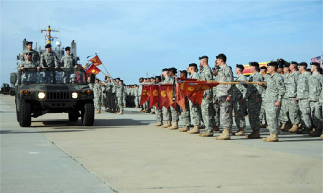 Inspection of the troops of 7th Sustainment Brigade is conducted at 3rd Port Tuesday during the change of command and change of responsibility ceremony.