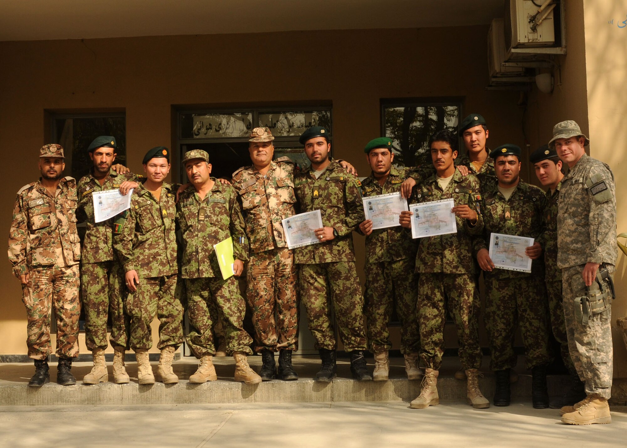 101104-N-6541W-028 KABUL, Afghanistan - Members of the Afghan Air Force graduate from Mi-17 Flight Engineer and Non Commissioned Officer Orientation courses. (U.S. Navy photo by Mass Communication Specialist 3rd Class Jared Walker/ RELEASED).