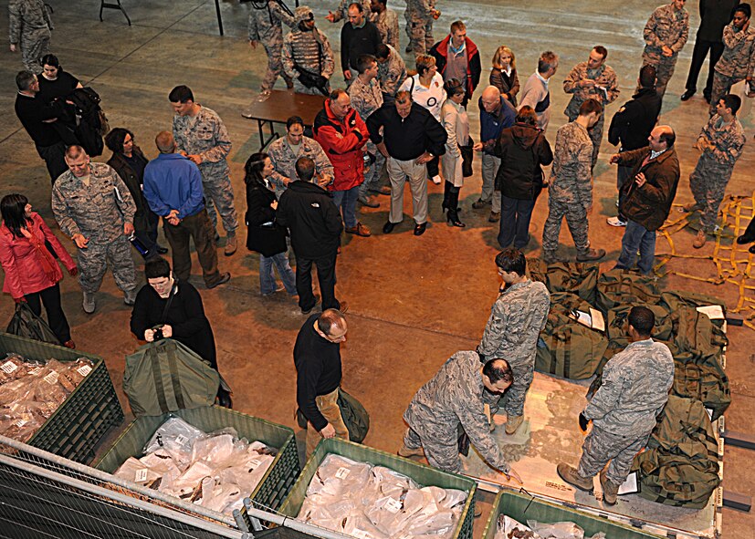 RAF MILDENHALL, England -- Base and honorary commanders go through a mock deployment line during the Honorary Commanders' Deployment Day here Nov. 4, 2010.  The events of the day allowed the honorary commanders to catch a glimpse of what servicemembers experience when they deploy.  (U.S. Air Force photo/Senior Airman Tabitha M. Lee)  