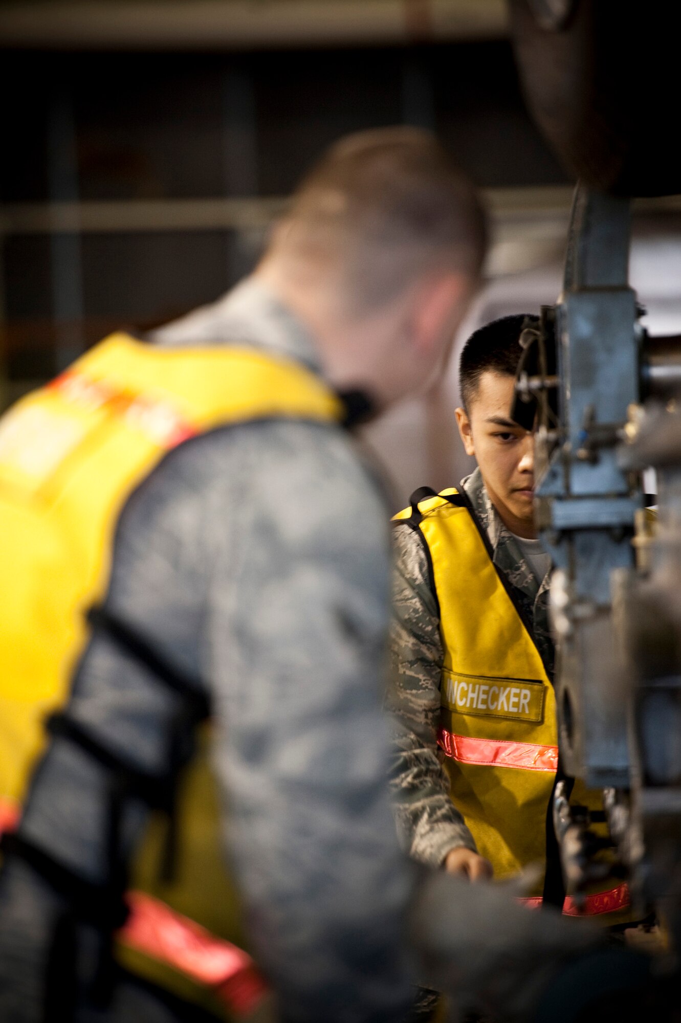 U.S. Air Force Airman 1st Class Kurt Geyrozaga, Cargo Deployment Function in-checker, measures the length of an F-16 Fighting Falcon engine trailer in Hangar 949, Misawa Air Base, Japan, during an operational readiness exercise, Nov. 5, 2010. Before cargo can be loaded onto a plane, it must be weighed and measured to load the aircraft in the most efficient way possible. (U.S. Air Force photo by Staff Sgt. Samuel Morse/Released)
