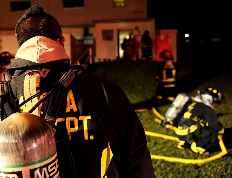 Firefighters from the 18th Civil Engineer Group put out a kitchen fire Nov. 3, Kadena Air Base, Japan. The fire, which was started by grease leaving a pot, was contained in the kitchen before it could spread throughout the house. According to the Federal Emergency Management Agency’s web site, cooking equipment, most often a range or stovetop, is the leading cause of reported home fires and home fire injuries in the United States. Cooking equipment is also the leading cause of unreported fires and associated injuries.(U.S. Air Force photo/Staff Sgt. Christopher Hummel)