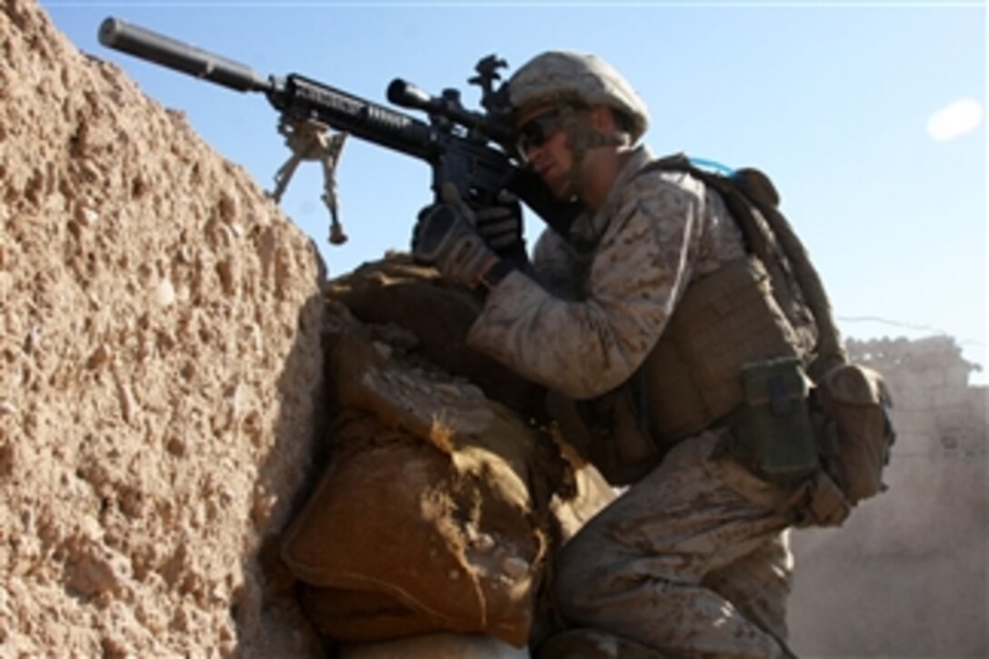 U.S. Marine Corps Lance Cpl. Steven J. Zandstra provides security at a checkpoint in Sangin, Helmand province, Afghanistan, on Nov. 1, 2010.  Zandstra is assigned to Police Advisor Team 1, 3rd Battalion, 5th Marine Regiment, Regimental Combat Team 2, whose mission is to conduct counterinsurgency operations in partnership with the International Security Assistance Force.  