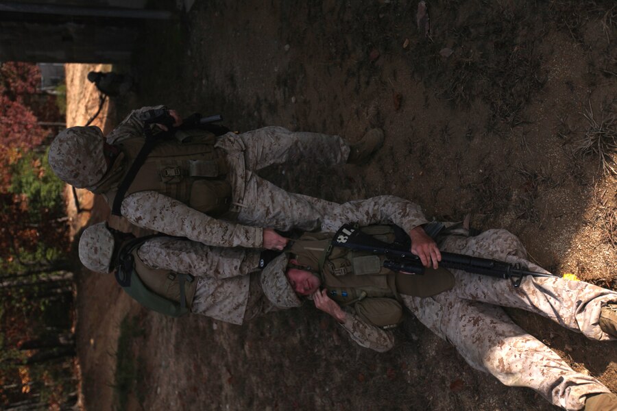 Marines with Provisional Security Platoon, 1st Supply Battalion, 4th Marine Logistics Group drag an “injured” Marine to safety during counter improvised explosive device training Nov. 5.