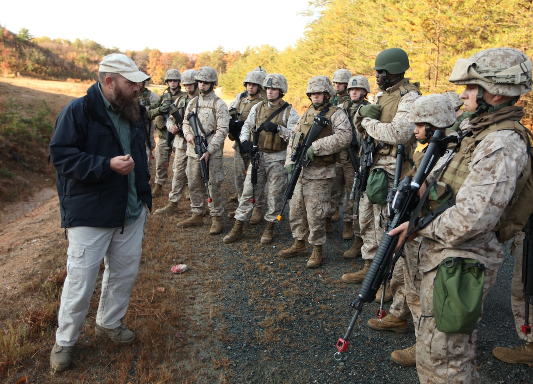Mike Parrell, a counter-improvised explosive device instructor with the Marine Corps Engineer Center, explains the various ways insurgents can hide IEDs to a group of Marines from Provisional Security Platoon, 1st Supply Battalion, 4th Marine Logistics Group during counter IED training Nov. 5. The PSP Marines are training for an upcoming deployment to Afghanistan.
