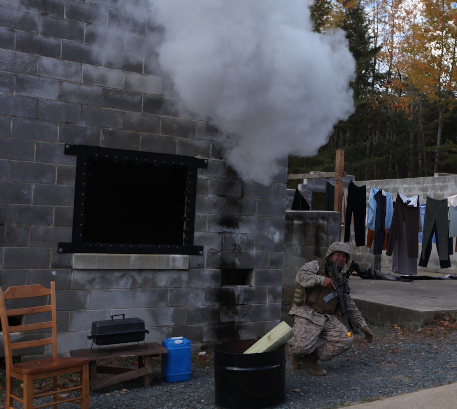 Lance Cpl. Gregory Perez, armorer with Provisional Security Platoon, 1st Supply Battalion, 4th Marine Logistics Group experiences a close up detonation of a mock improvised explosive device during counter IED training Nov. 5.