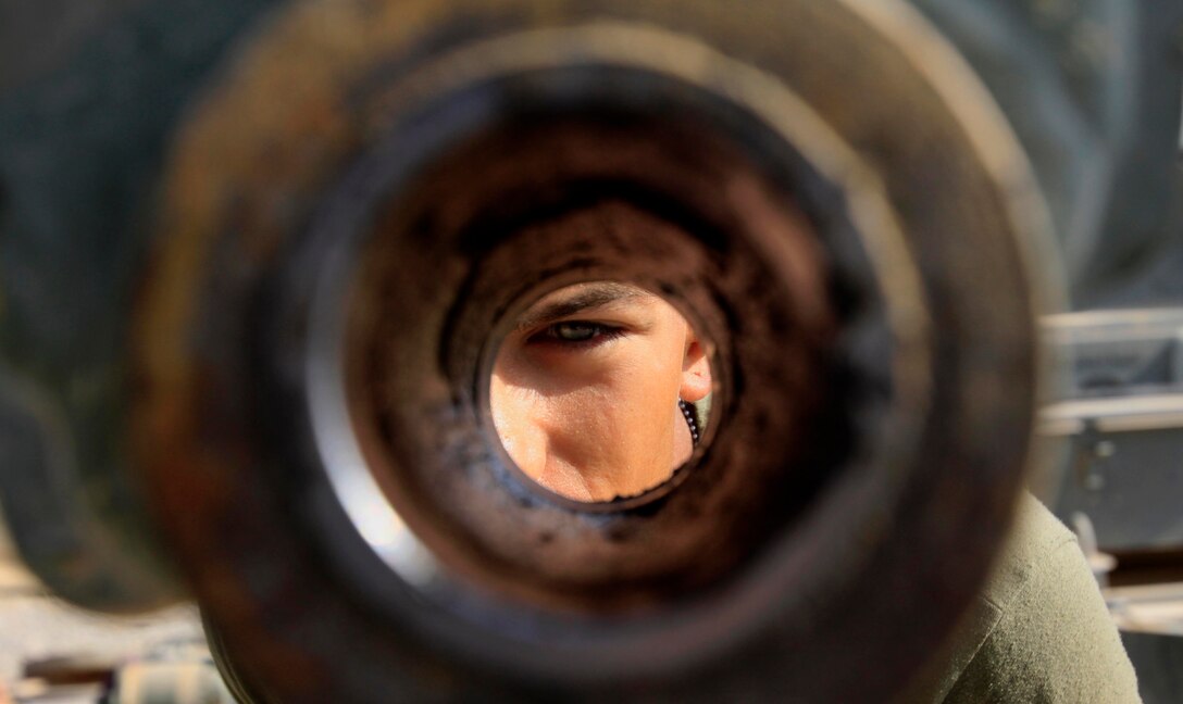 Lance Cpl. Steven Stolz, 19, engineer equipment mechanic, Support Company, Combat Logistics Battalion 3, 1st Marine Logistics Group (Forward), inspects a piece of equipment for cleanliness on a heavy equipment vehicle known as a Backhoe Loader on Camp Dwyer, Afghanistan, Nov. 5. Stolz and nine other Marines in CLB-3's heavy equipment maintenance section are tasked with repairing heavy equipment vehicles for several units throughout Helmand Province.