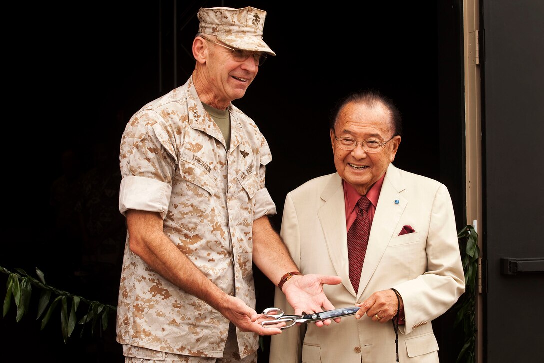 Lt. Gen. Duane Thiessen, commander, U.S. Marine Corps Forces, Pacific, poses with U.S. Sen. Daniel Inouye after cutting the ribbon at the new Supporting Arms Virtual Trainer building on Marine Corps Base Hawaii, Nov. 5, 2010. According to the Marine Corps Systems Command, the SAVT is a device used to train joint terminal attack controllers, forward air controllers, and forward observers in the placement of tactical ordnance for close air support, naval surface fires and surface fires. The trainer will be used to support initial schoolhouse requirements and annual currency requirements. During his visit, Inouye, a former captain with the U.S. Army’s decorated 442nd Regimental Combat Team, also shared his experiences with officers at the Officer’s Club here.