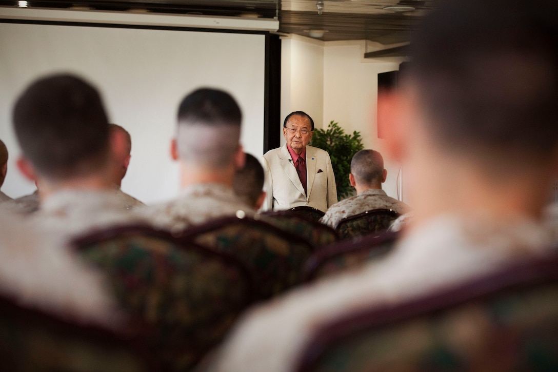 U.S. Sen. and Medal of Honor Recipient Daniel Inouye speaks to Marine and Navy officers at the Officer’s Club on Marine Corps Base Hawaii, Nov. 5, 2010. Prior to sharing his experiences, the former captain, a decorated World War II veteran with the U.S. Army’s famed 442nd Regimental Combat Team, cut the ribbon at the base’s new Supporting Arms Virtual Trainer facility. The SAVT will be used to train joint terminal attack controllers, forward air controllers, and forward observers in the placement of tactical ordnance for close air support, naval surface fires and surface fires.
