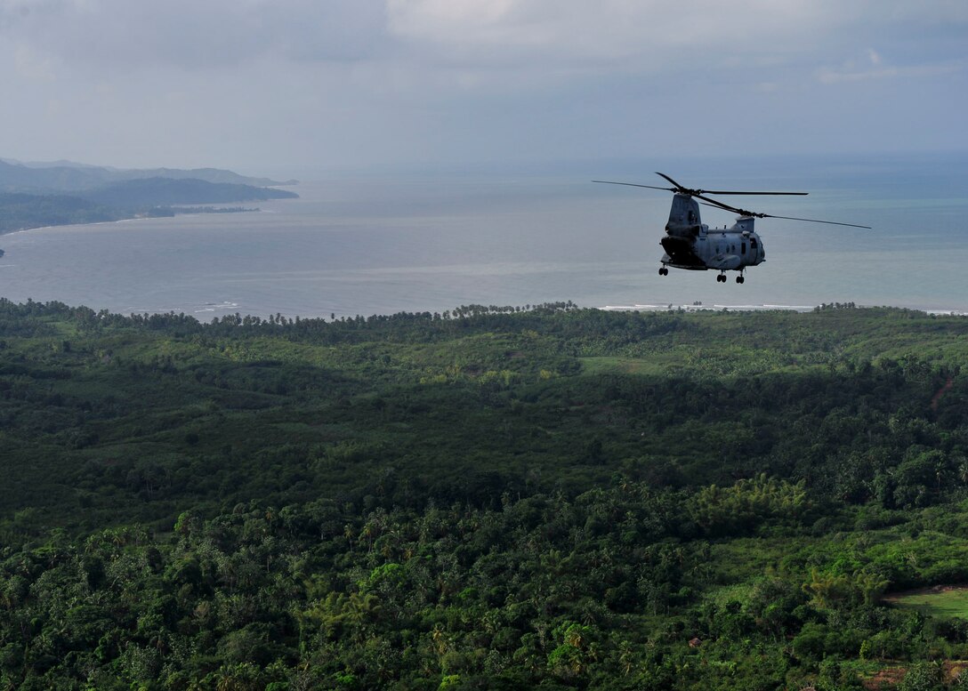 A CH-46E Sea Knight helicopter assigned to Marine Medium Helicopter Squadron (HMM) 774, embarked aboard the multi-purpose amphibious assault ship USS Iwo Jima (LHD 7), conducts aerial assessments of Haiti after Hurricane Tomas made landfall. Iwo Jima is preparing to support of the Government of Haiti, the UN Stabilization Mission in Haiti and the U.S. Agency for International Relief.::r::::n::