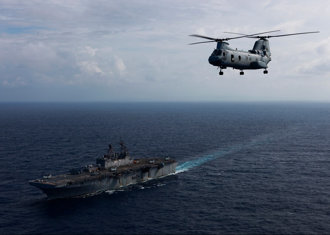 U.S. Marines and Sailors aboard a medium-lift, dual rotor CH-46E Sea Knight helicopter with Marine Medium Helicopter Squadron (HMM) 774, attached to Special-Purpose Marine Air-Ground Task Force Continuing Promise 2010 (CP10), conduct a site survey via a medium-lift, dual rotor CH-46E Sea Knight helicopter with Marine Medium Helicopter Squadron (HMM) 774, attached to Special-Purpose Marine Air-Ground Task Force CP10, in the area of Port-Au-Prince, Haiti, Nov. 6, 2010, to gather an understanding of the destruction caused by Hurricane Tomas. If tasked, the amphibious assault ship USS Iwo Jima will ensure safety and effectively conduct humanitarian relief operations so that lives are saved and near-term suffering is minimized in support of the government of Haiti, MINUSTAH and USAID. Service members and civilians are deployed in support of CP10 providing medical, dental, veterinary, engineering assistance and subject-matter exchanges to the Caribbean, Central and South America.