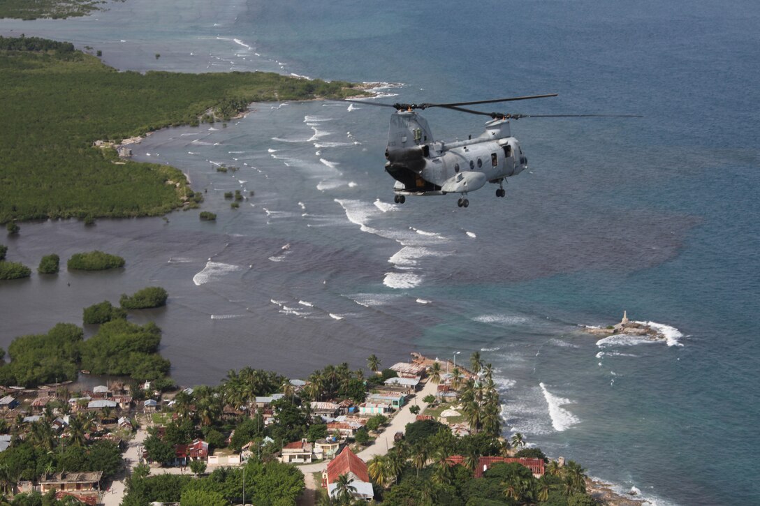 A CH-46E Sea Knight helicopter with Marine Medium Helicopter Squadron 774 assesses the aftermath of Hurricane Tomas off the southern claw of Haiti, Nov. 6, 2010, in preparation for tentative disaster relief efforts to the region in support of the government of Haiti, MINUSTAH and USAID. Marines and sailors embarked aboard USS Iwo Jima attached to Special-Purpose Marine Air-Ground Task Force concluded humanitarian operations in Paramaribo, Suriname, Nov. 1, 2010, for Haiti relief efforts.