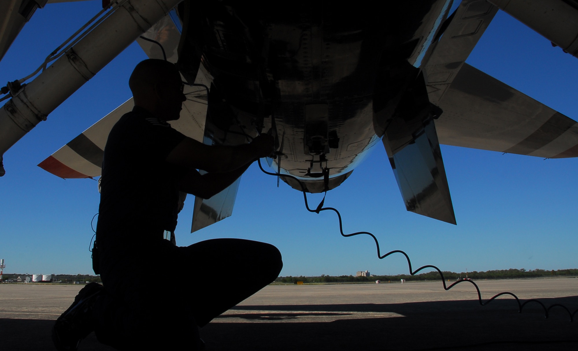An Air Force Thunderbirds maintainer performs a pre-inspection on a Thunderbird F-16 Fighting Falcon prior to a flight Nov. 5, 2010, at Lackland Air Force Base, Texas. Unlike any other fighter squadron in the Air Force, the Thunderbird pilots do not do a typical walk-around inspection but rely on their crew chiefs to carry out that responsibility. The air demonstration team was at Lackland AFB to perform during AirFest 2010.  (U.S. Air Force photo/Staff Sgt. Jamie Powell)