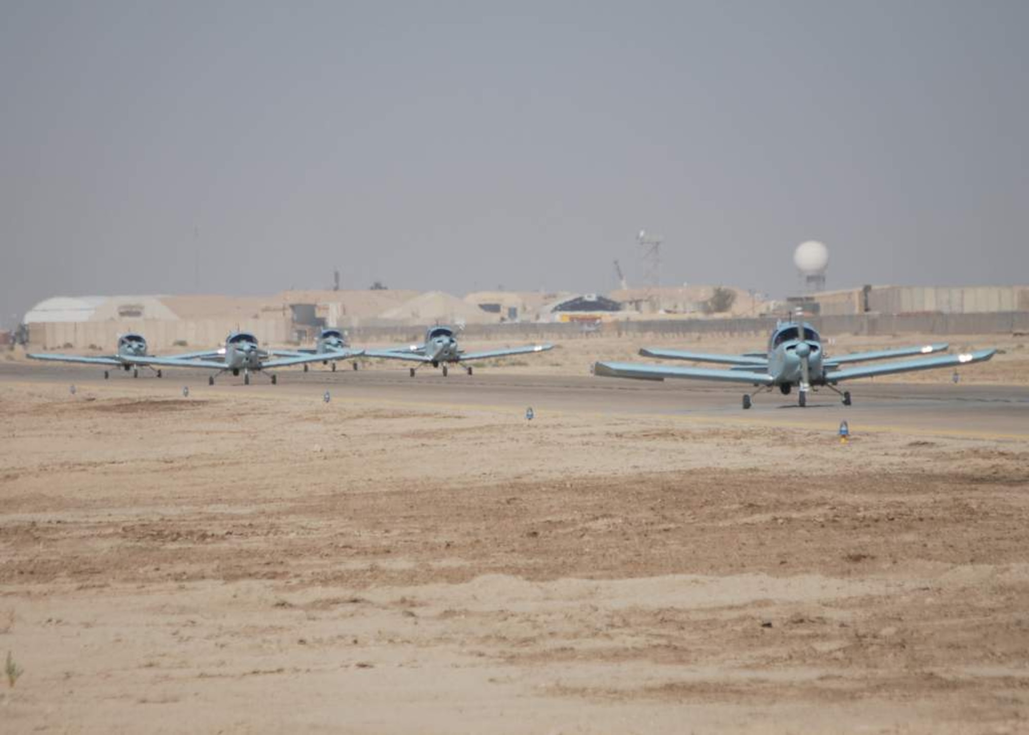 Iraqi air force CH-2000s arrive Oct. 17, 2010, at Ali Air Base, Iraq after being transferred from Basrah Air Base by the Iraqi Ministry of Defense.  Iraqi air force Squadron 70 flies intelligence, surveillance and reconnaissance missions. After moving, Sq. 70 flew their first mission from Ali Base with U.S. Army AH-64 Apaches Oct 25, 2010, providing ISR security of the Hajj - an annual pilgrimage of citizens to Mecca - while also providing ISR support of a main supply route and oil pipeline. (U.S. Air Force photo by Staff Sgt. Eric Donner) (Released)