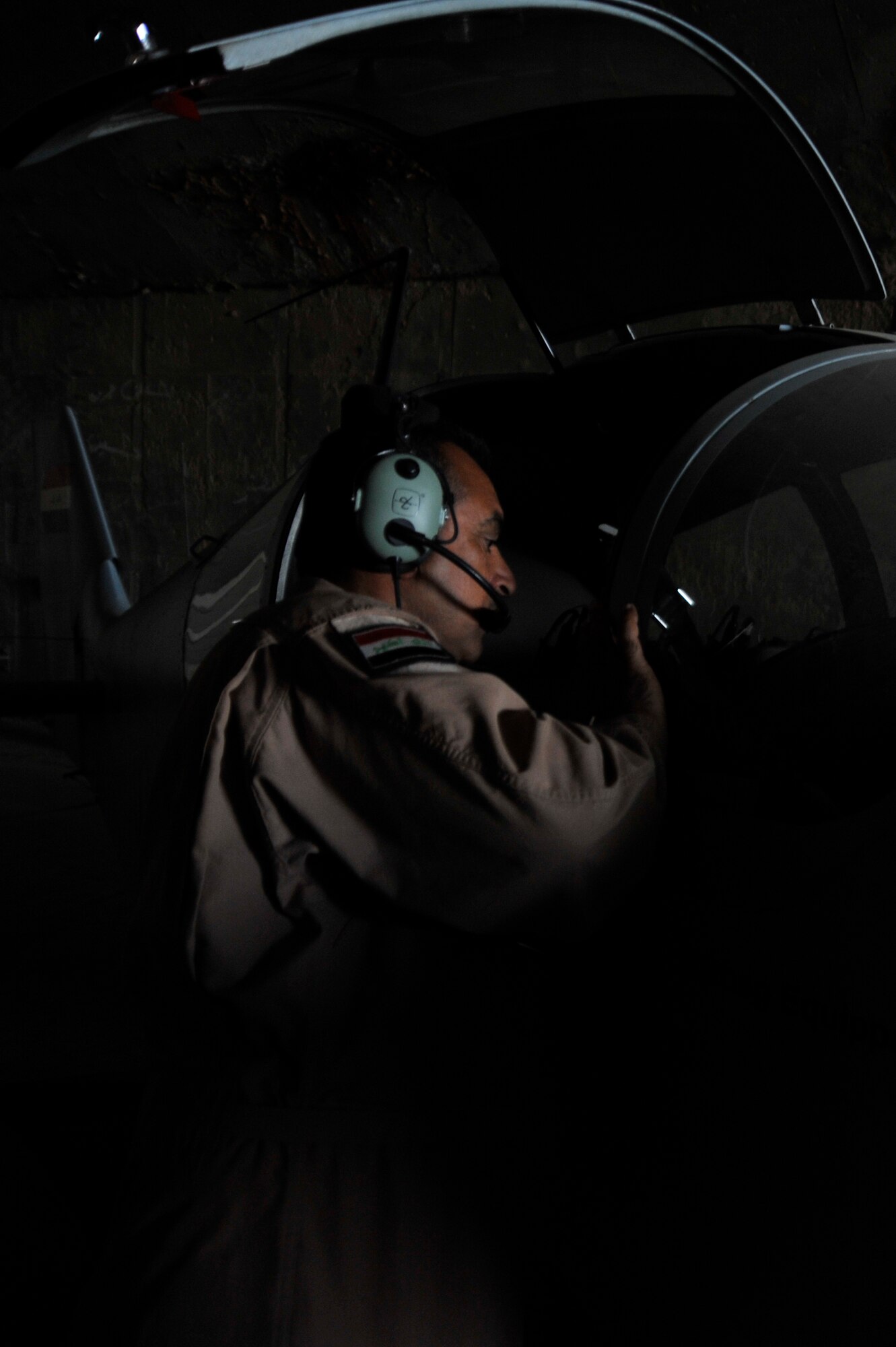 Iraqi air force airmen check their CH2000 for any damage after a sand storm, Oct. 24, 2010, at Ali Air Base, Iraq, after being transferred from Basrah Air Base by the Iraqi Ministry of Defense.  Iraqi air force Squadron 70 flies intelligence, surveillance and reconnaissance missions. After moving, Sq. 70 flew their first mission from Ali Base with U.S. Army AH-64 Apaches Oct 25, 2010, providing ISR security of the Hajj - an annual pilgrimage of citizens to Mecca - while also providing ISR support of a main supply route and oil pipeline.  (U.S. Air Force photo by Senior Airman Perry Aston) (Released)