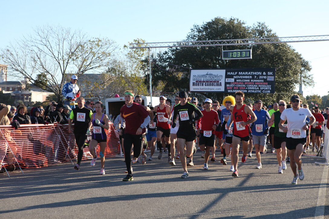 Runners take off at the start of the Carolina Sports Medicine’s 12th annual Battleship Half Marathon in Wilmington, N.C., Nov. 7.  The 13.1-mile race started and ended at the Battleship USS North Carolina and was dedicated to the men and women who have served and are currently serving in the United States Armed Forces.