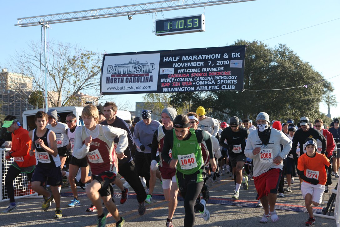 Athletes take off at the start of the Carolina Sports Medicine’s Bay Six Battleship 5K race in Wilmington, N.C., Nov. 7.  The five-kilometer race started just minutes after the 12th annual Battleship Half Marathon, and both races were dedicated to the men and women who have served and are currently serving in the United States Armed Forces.