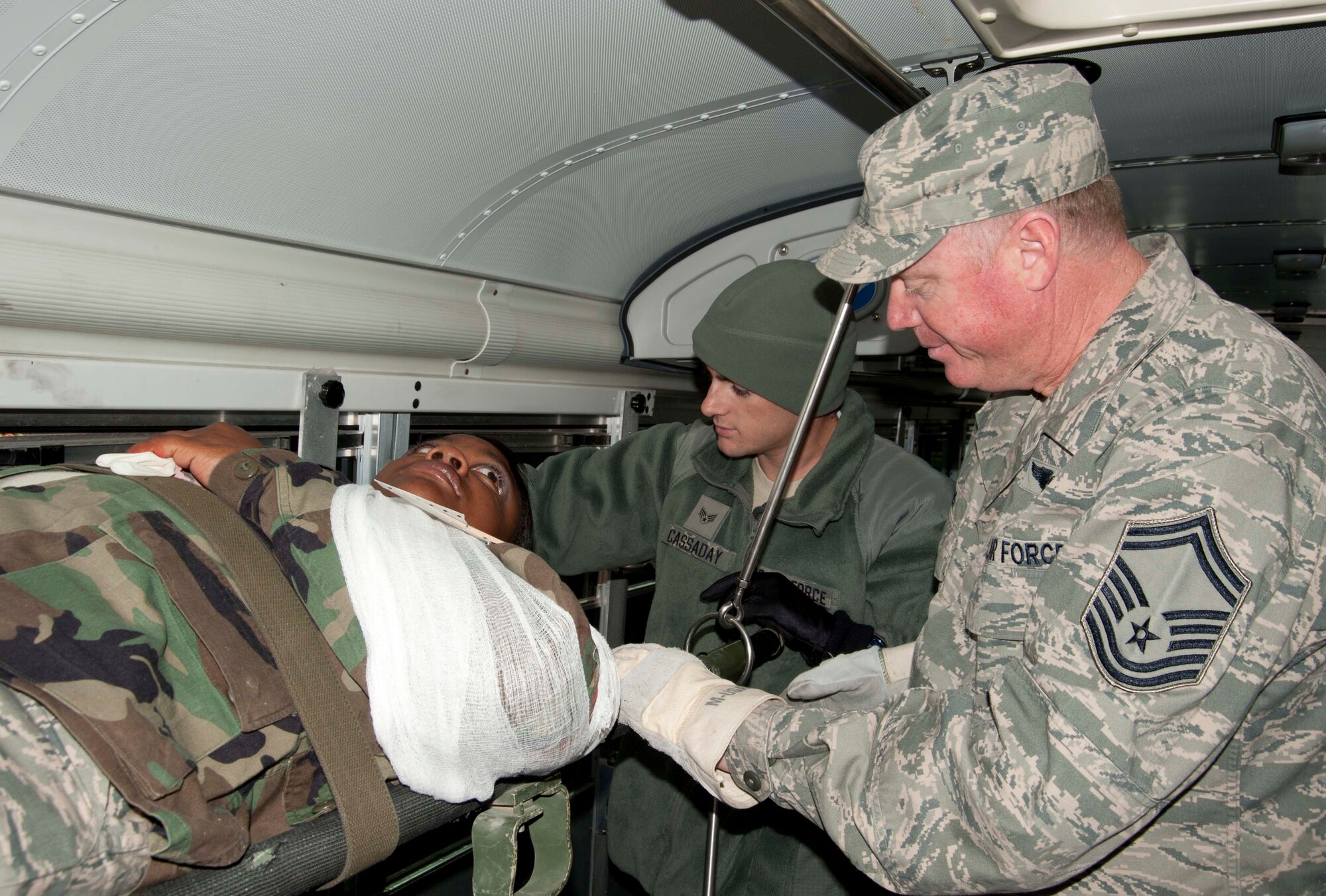 Senior Master Sgt. John Gambs, 403rd Aeromedical Staging Squadron administrative technician, and Senior Airman Michael Cassaday, 403rd ASTS medical technician, secure a “patient” for transport to the flightline for aeromedical evacuation. Senior Airman Marshelle Ely, 403rd ASTS, simulated a right shoulder injury from shrapnel received during the mass casualty exercise. The exercised was conducted during the November Unit Training Assembly in preparation for the 403rd Wing’s upcoming Operation Readiness Inspection.