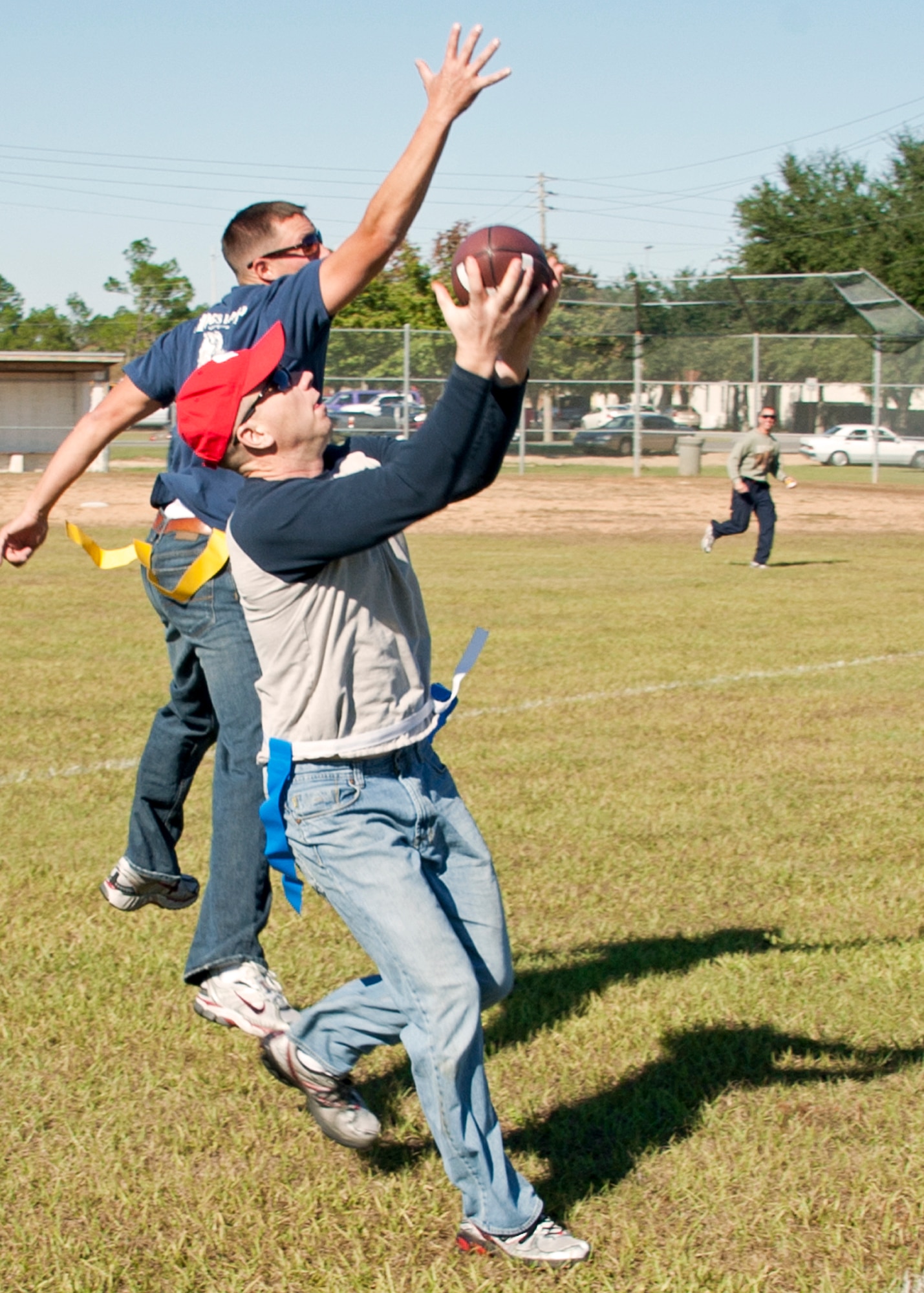 The “Blue team” receiver catches a touchdown pass during the flag-football game at the 919th Special Operations Wing “family day” event at Duke Field, Nov. 6.   The Family Day event brought reservists and their families together for food, games and music. (Air Force photo/Tech. Sgt. Samuel King Jr.)