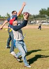 The “Blue team” receiver catches a touchdown pass during the flag-football game at the 919th Special Operations Wing “family day” event at Duke Field, Nov. 6.   The Family Day event brought reservists and their families together for food, games and music. (Air Force photo/Tech. Sgt. Samuel King Jr.)