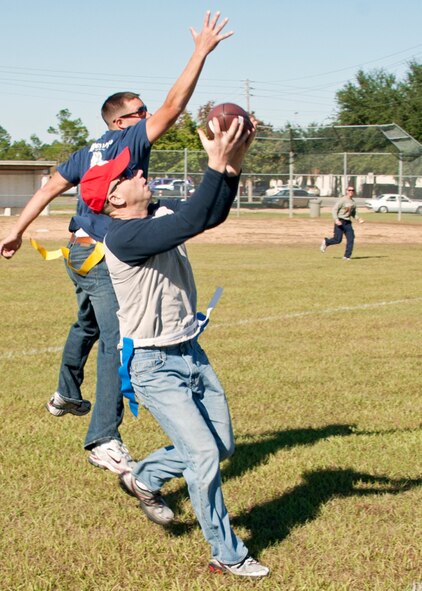 The “Blue team” receiver catches a touchdown pass during the flag-football game at the 919th Special Operations Wing “family day” event at Duke Field, Nov. 6.   The Family Day event brought reservists and their families together for food, games and music. (Air Force photo/Tech. Sgt. Samuel King Jr.)
