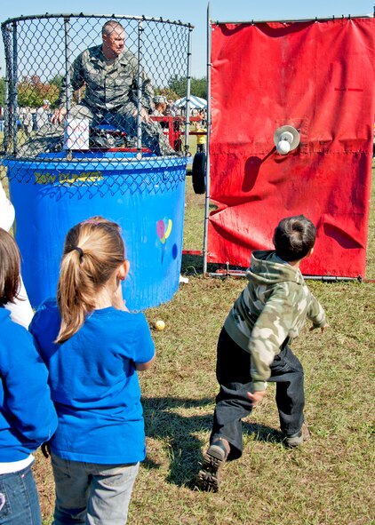 Lt Col. Scott McDonald ,919th Logistics Readiness Squadron commander, prepares for a cold dip in the dunking booth at the 919th Special Operations Wing “family day” event at Duke Field, Nov. 6.   The Family Day event brought reservists and their families together for food, games and music. (Air Force photo/Tech. Sgt. Samuel King Jr.)