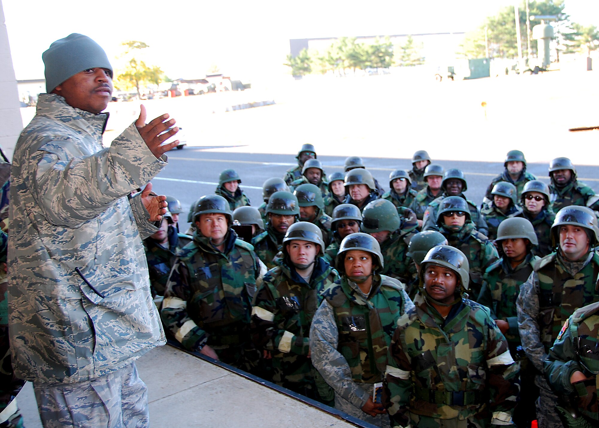 JOINT BASE MCGUIRE-DIX-LAKEHURST, N.J. -- Senior Airman Manuel King, 514th Civil Engineer Squadron, directs particpants in a mobility exercise here Nov. 6, 2010. The exercise tested Airmen's level of deployment preparation and their ability to survive and operate in a combat zone. (U.S. Air Force photo/Staff Sgt. Monica Dalberg)