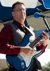 Lt Col. David Booher, 919th Maintenance Squadron, leads his band “Jaded Clark” during the 919th Special Operations Wing “family day” event at Duke Field, Nov. 6.   The Family Day event brought reservists and their families together for food, games and music. (Air Force photo/Tech. Sgt. Samuel King Jr.)