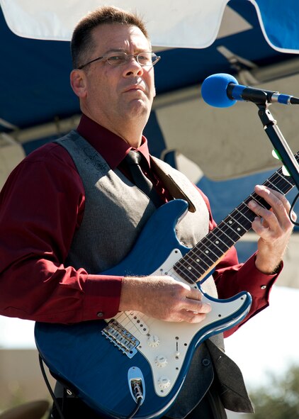 Lt Col. David Booher, 919th Maintenance Squadron, leads his band “Jaded Clark” during the 919th Special Operations Wing “family day” event at Duke Field, Nov. 6.   The Family Day event brought reservists and their families together for food, games and music. (Air Force photo/Tech. Sgt. Samuel King Jr.)