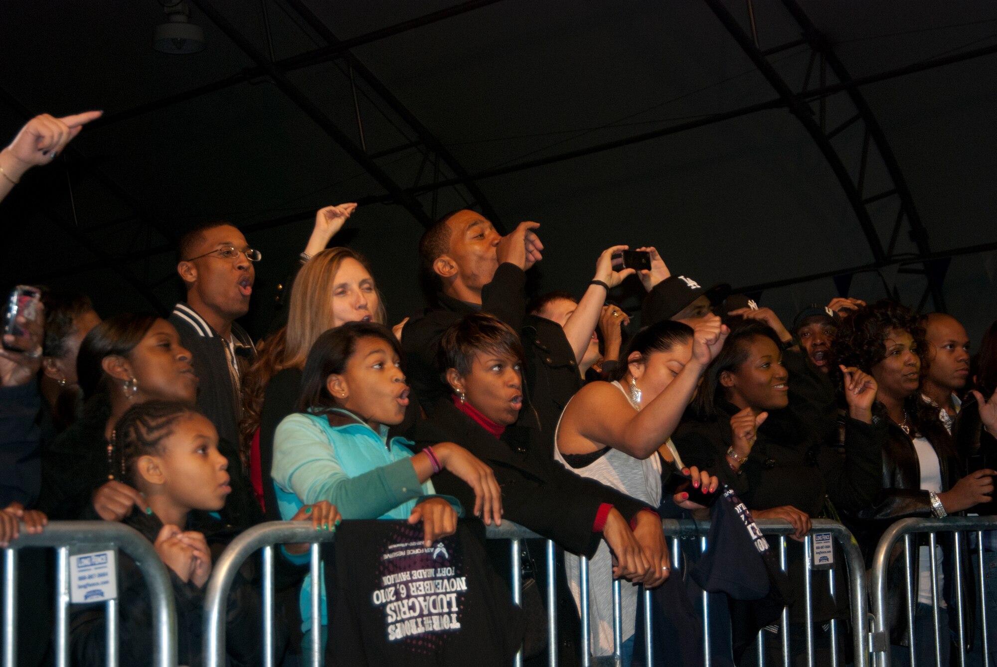 FORT MEADE, Md. -- Grammy-winning rapper, Ludacris, backed up by vocals from fellow rapper, Lil Fate, performs for a crowd of over 1,000 servicemembers, federal employees, friends and family at the Fort Meade Pavilion here Nov 6.  Ludacris partnered with Air Force Reserve Command Recruiting Service and Blaine Warren Advertising to host a special event for servicemembers and potential Air Force Reservists as part of the recruiting service's initiative, "Get 1 Now - Refer a Friend Tour."   In order to reach potential new Reservists, Reserve recruiting is bringing popular music artists to perform for servicemembers and others who participate in the recruiting campaign.  The next scheduled event in this area is Usher on Dec. 17. (U.S. Air Force photo/ Capt. Rebecca A. Garcia)