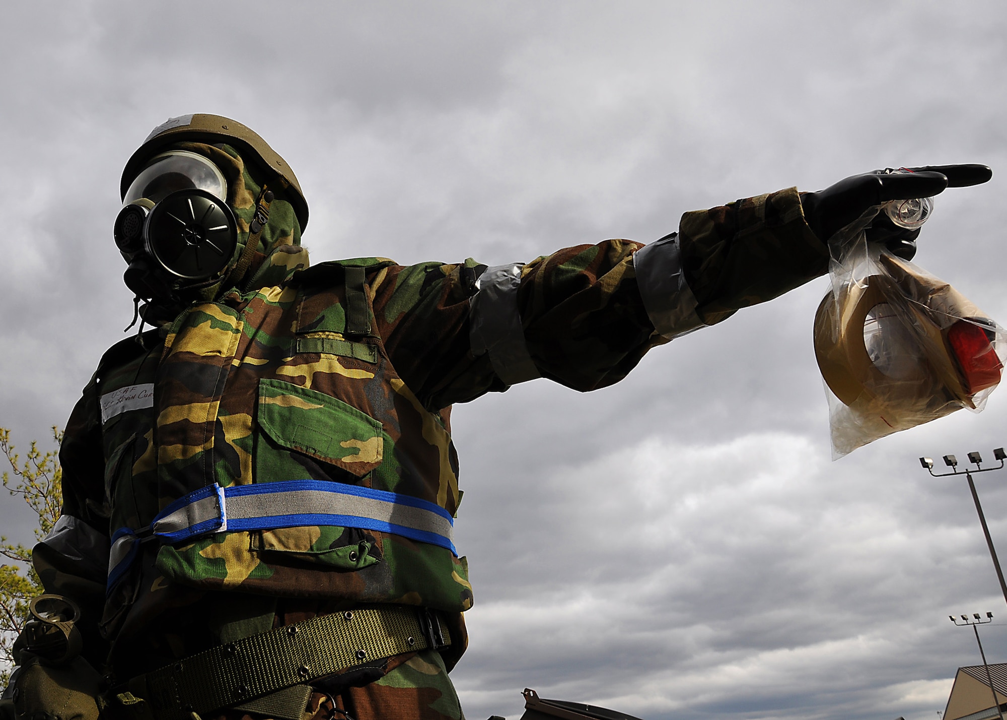 JOINT BASE MCGUIRE-DIX-LAKEHURST, N.J. -- Staff Sgt. Kevin Curry, 514th Aeromedical Staging Squadron, gestures toward a stand containing M-8 Chemical Agent Detection Paper during a mobility exercise here Nov. 6, 2010. As part of the exercise, Sergeant Curry performed a post-attack-reconnaissance sweep of the perimeter around his work location. During a PAR sweep, Airmen should search for unexploded ordnance, evidence of chemical contamination, or other potential hazards. (U.S. Air Force photo/Tech. Sgt. Shawn J. Jones)