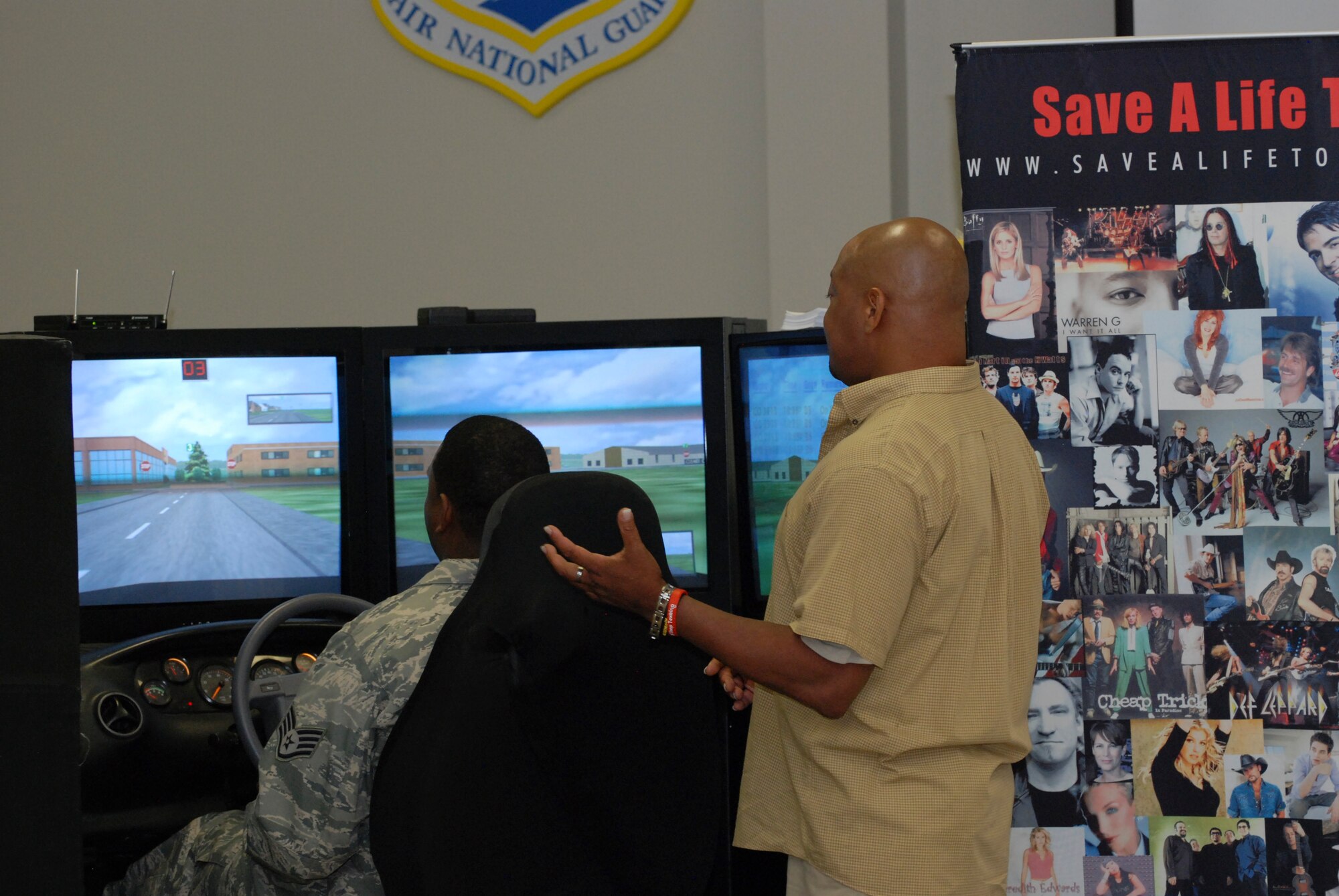 A Dobbins Air Reserve Base Airman attempts to drive the Save a Life Tour simulator to determine hie inability to drive while under the influence of alcohol.    (U.S. Air Force photo/Master Sgt. Stan Coleman) 