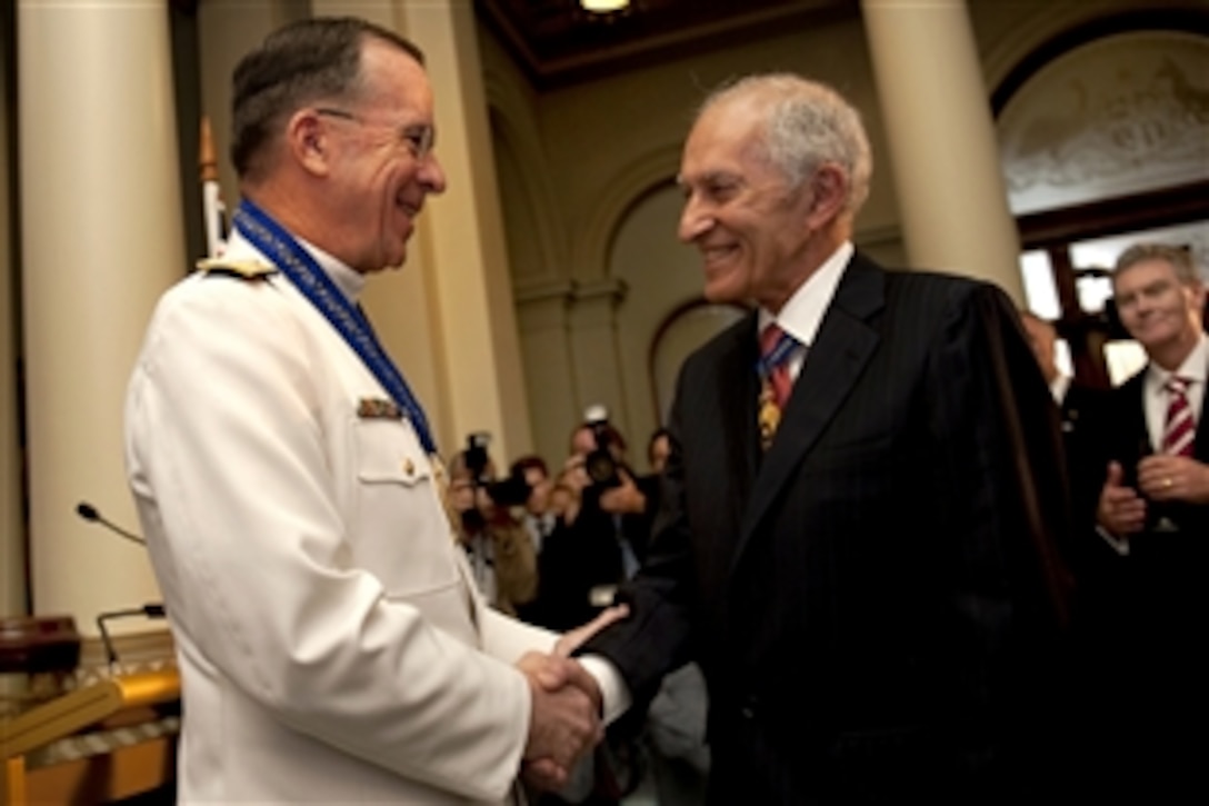 U.S. Navy Adm. Mike Mullen, chairman of the Joint Chiefs of Staff, is congratulated by Governor of Victoria, David de Kretser, after being presented the Officer of the Order of Australia in Melbourne, Australia, Nov. 7, 2010. Mullen is visiting Australia for the annual Australia-U.S. Ministerial with Defense Secretary Robert M. Gates and Secretary of State Hillary Rodham Clinton.