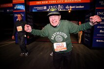 Retired Marine Col. Jonathan Mendes crosses the finish line at the end of the ING New York City Marathon, Nov. 7. The 90-year-old was the oldest entrant in the race and crossed the finish after 9 hours and 55 minutes. He is considering training for the 2014 marathon in which he would set the record for the oldest entrant ever to compete in the New York City Marathon. As a Marine officer with 32 years of service, Mendes trained hall of fame baseball player Ted Williams and astronaut John Glenn, he is also a decorated dive-bomber pilot.
