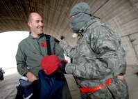 Chad Lewis, a former Philadelphia Eagles tight end, hands out NFL gear to Airmen working on the flightline.  Chad Lewis is the NFL's ambassador to China and visited Osan Air Base Nov. 8.  Mr. Lewis spoke to Airmen about his football career and leadership on and off the field. (U.S. Air Force Photo/Senior Airman Evelyn Chavez)