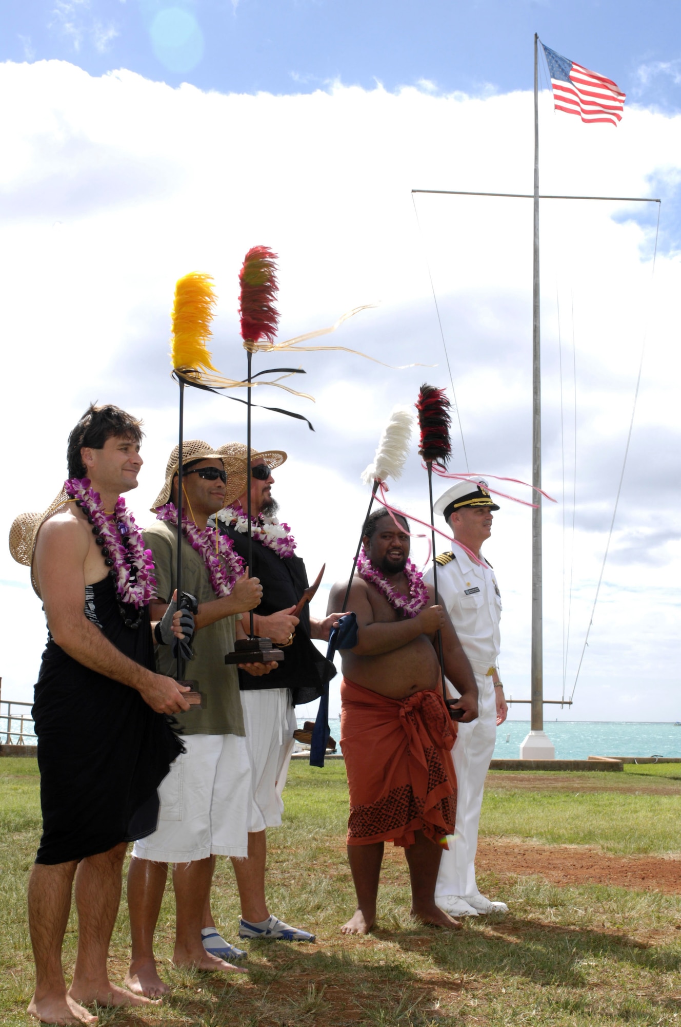 Captain Richard Kitchens, Commander, Joint Base Pearl Harbor-Hickam, Hawaii poses with winners of the traditional games competition during the Makahiki ceremony at Hickam Harbor Nov. 6 at Joint Base Pearl Harbor-Hickam, Hawaii.  (Photo by David D. Underwood, Jr.)