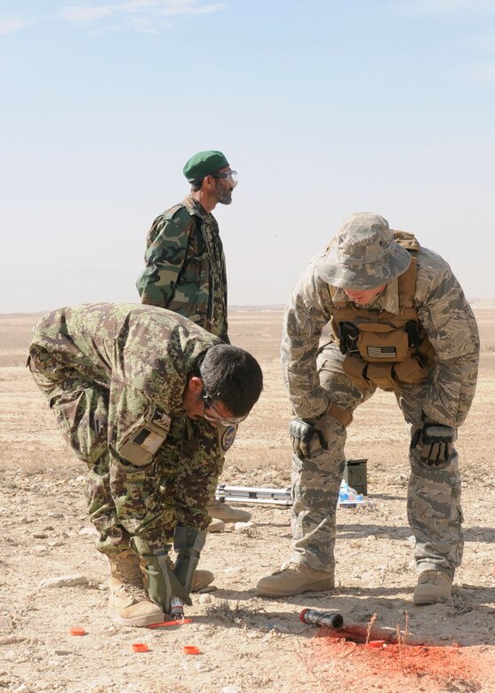Afghan life support airmen practice using signaling devices. They will begin teaching this skill to Afghan air force pilots so they know how to signal for rescue. (U.S. Navy photo/Petty Officer 3rd Class Jared Walker) 