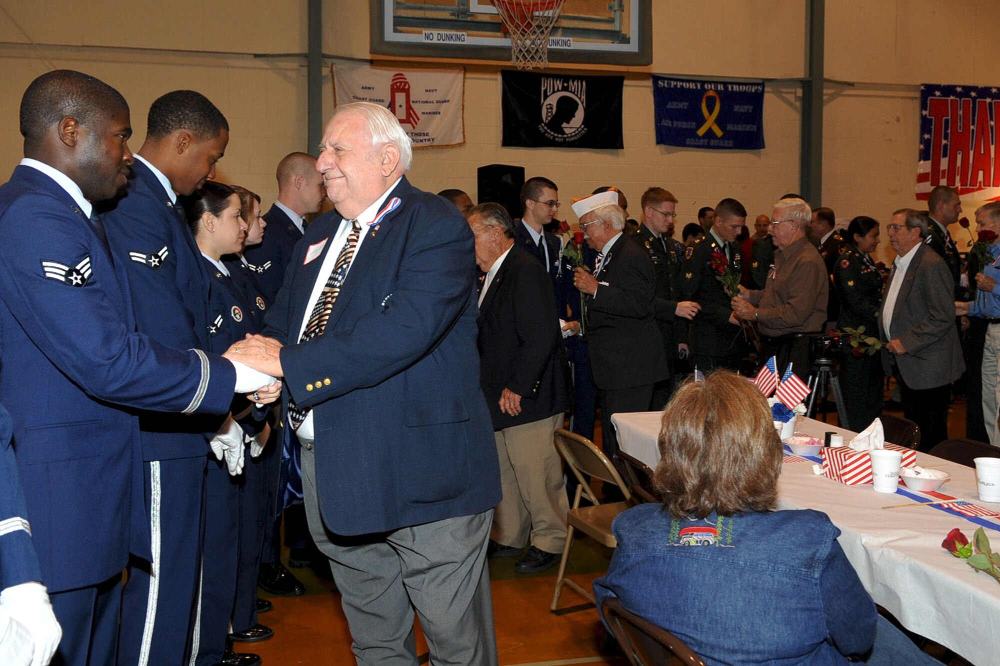 CHESAPEAKE, Va. -- Retired veterans honor active-duty military during the Veteran's Day ceremony Nov. 4. The Niners Citizen's Club hosted the event at the South Norfolk Community Recreation Center to honor all active-duty and retired military.(U.S. Air Force photo/Staff Sgt. Ashley Hawkins)(RELEASED)