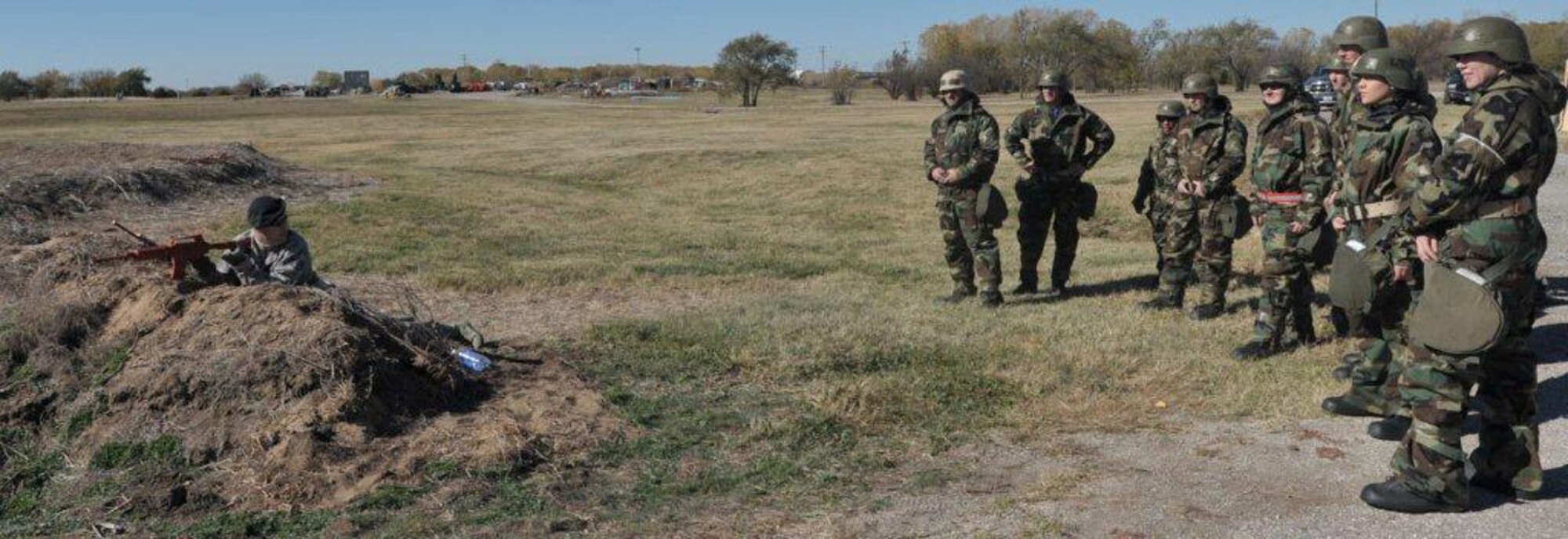 Staff Sgt. Bradley Enochs, unit securitymanager at the 931st Security Forces demonstrates selective fighting positions and challenge/response procedures for members of the 931st Air Refueling Group during the Ability to Survive and Operate training held during the unit training assembly, Nov. 7.   
