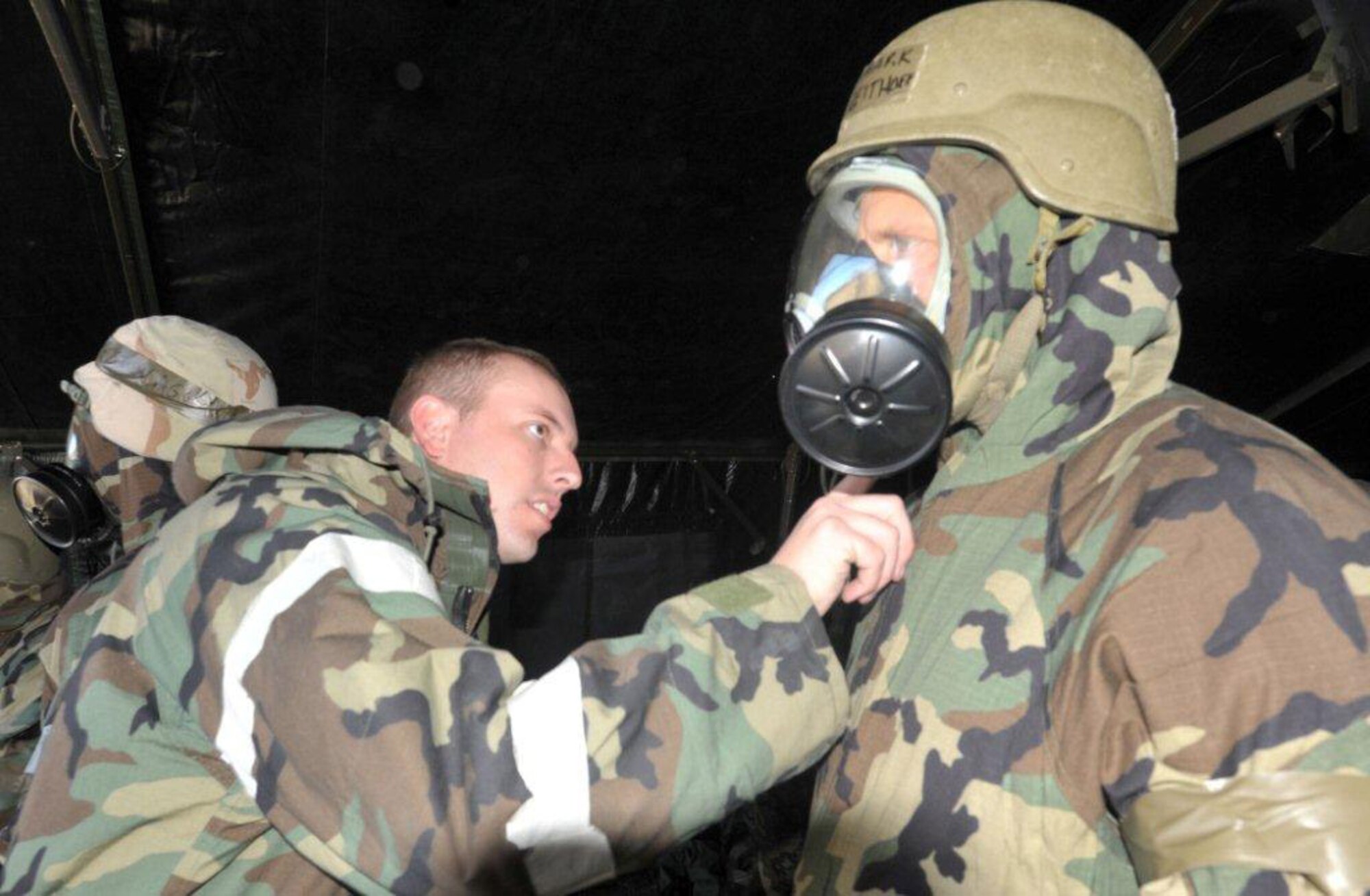 Staff Sgt. Gregory Godfrey, 931st
Civil Engineering squadron, checks Staff Sgt. Greg Brashiers' protective
mask during the Ability to Survive and Operate training held for all 931st
Air Refueling Group personnel during the November Unit Training Assembly.  
(USAF photo by Staff Sgt. Carrie Peasinger)
