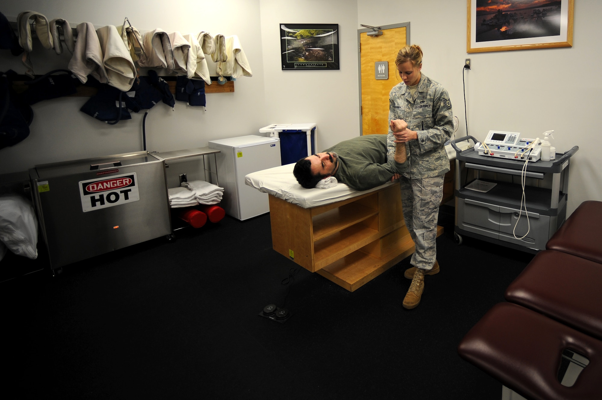 Tech. Sgt. Eva Graney, 509th Medical Group physical therapy NCO in charge, works with Tech. Sgt. (ret.) Ben Anderson during a physical therapy session to help him recover from a torn rotator cuff, Nov. 5. Sergeant Anderson has been in therapy for two and a half months and will continue therapy for another three months before making a full recovery. (U.S. Air Force photo by Senior Airman Kenny Holston)(Released)  

