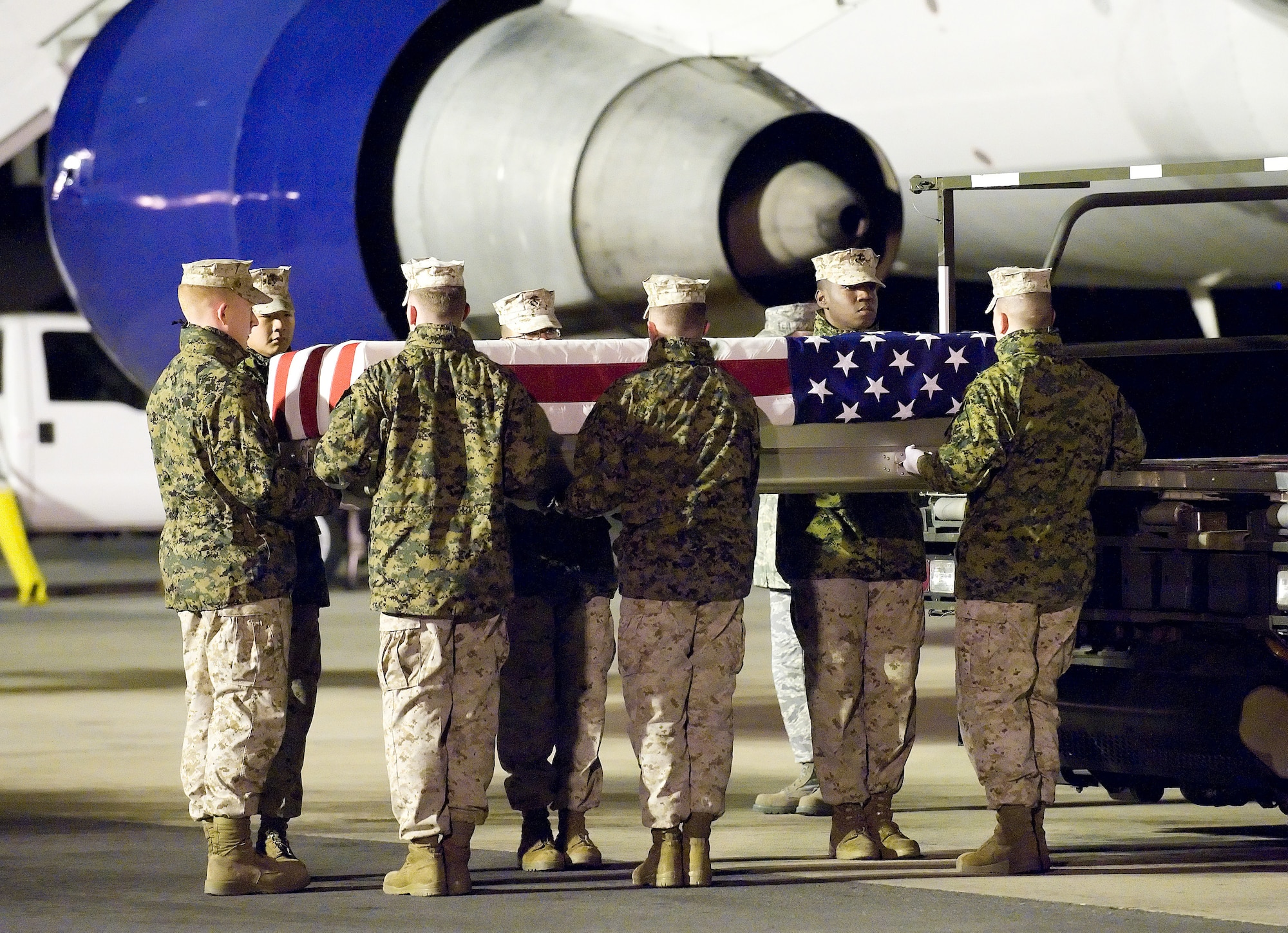 A U.S. Marine Corps carry team transfers the remains of Marine Lance Cpl. Brandon W. Pearson of San Diego, Calif., at Dover Air Force Base, Del., Nov. 6, 2010.  Pearson was assigned to the 3rd Battalion, 5th Marine Regiment, 1st Marine Division, I Marine Expeditionary Force, Camp Pendleton, Calif. (U.S. Air Force photo/Jason Minto)