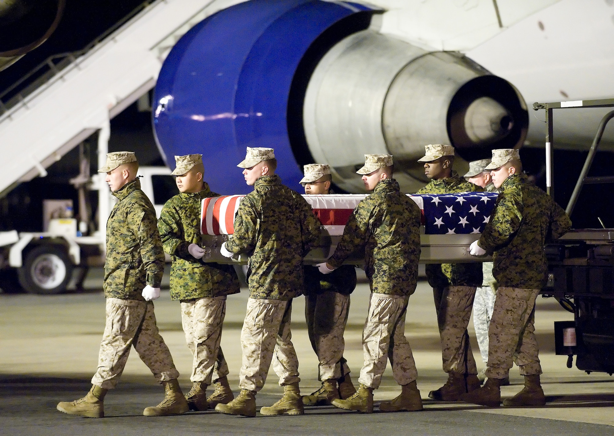 A U.S. Marine Corps carry team transfers the remains of Marine Lance Cpl. Matthew J. Broehm of Peoria, Ariz., at Dover Air Force Base, Del., Nov. 6, 2010.  Broehm was assigned to the 3rd Battalion, 5th Marine Regiment, 1st Marine Division, I Marine Expeditionary Force, Camp Pendleton, Calif. (U.S. Air Force photo/Jason Minto)