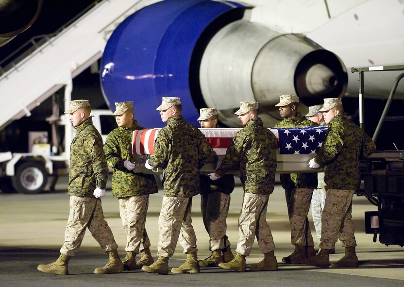 A U.S. Marine Corps carry team transfers the remains of Marine Lance Cpl. Matthew J. Broehm of Peoria, Ariz., at Dover Air Force Base, Del., Nov. 6, 2010.  Broehm was assigned to the 3rd Battalion, 5th Marine Regiment, 1st Marine Division, I Marine Expeditionary Force, Camp Pendleton, Calif. (U.S. Air Force photo/Jason Minto)