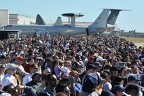 The crowd at AirFest 2010 watches aerial demonstrations at Lackland Nov. 7. More than 574,000 people attended the two-day show that featured the Air Force Thunderbirds demonstration team, the Army parachute-jumping Golden Knights team, and Tora! Tora! Tora!, a re-enactment of Pearl Harbor. (U.S. Air Force photo/Alan Boedeker)