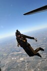A member of the Army Golden Knights parachute team drops into AirFest 2010. The Golden Knights demonstrated the maneuverability of the human body while falling from the sky at 120 mph. The team performed four formations, including the cutaway maneuver which demonstrated what would happen if a jumper's parachute malfunctioned. (U.S. Air Force photo/Alan Boedeker)

