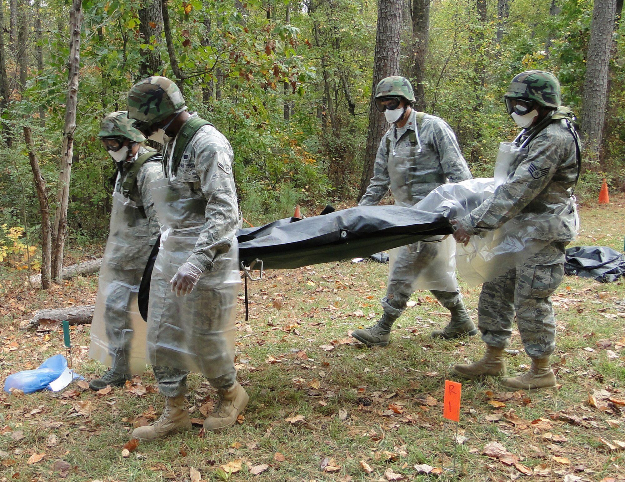 DOBBINS ARB, Ga.--Four of the eight 910th Force Support Squadron team members demonstrate recovering human remains during the 2010 AFRC Force Support Readiness Competition held November 1-4, 2010.  The 910th team took first place out of five competing teams.  U.S. Air Force photo by Tech. Sgt. Amber Leone 