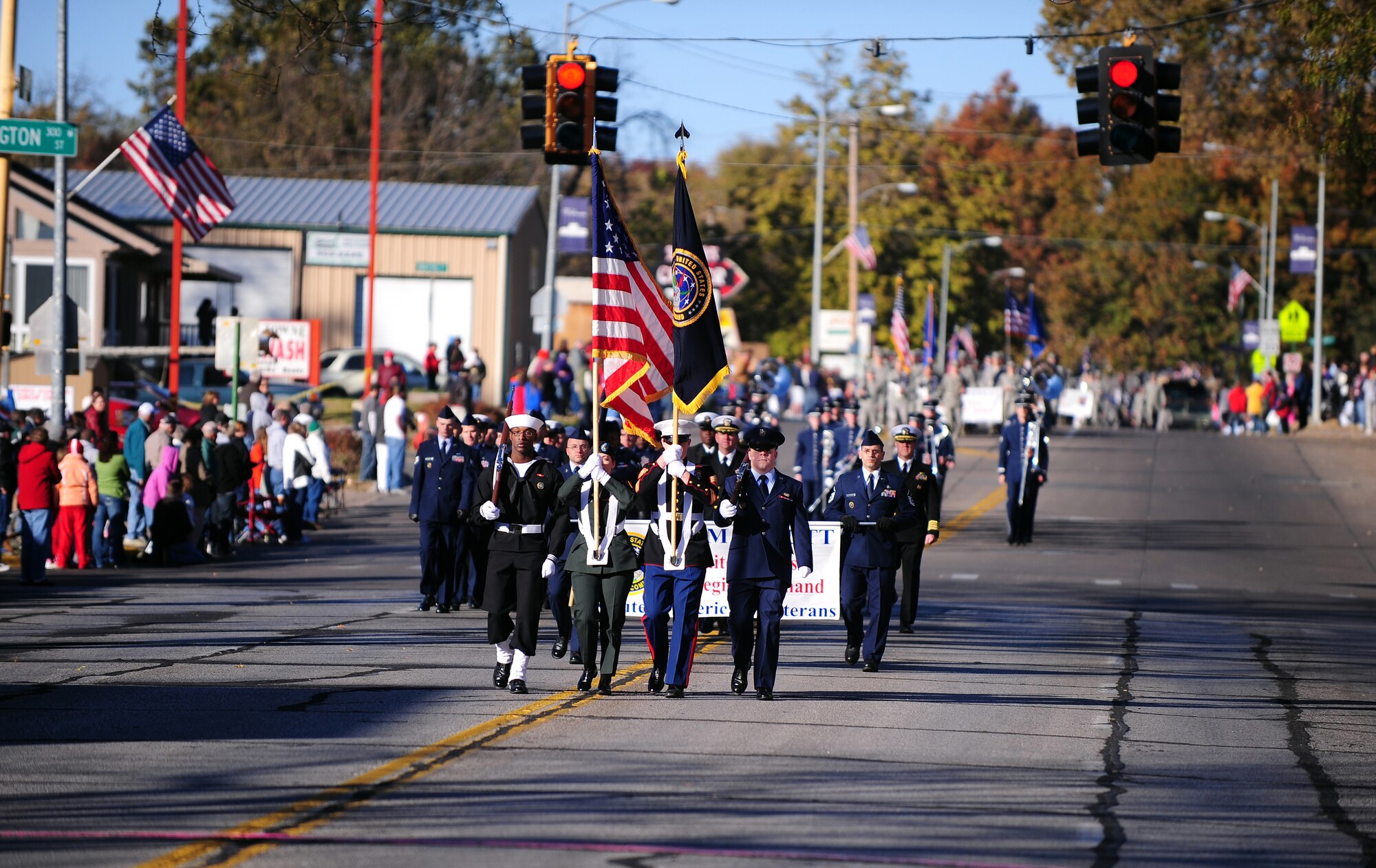 OFFUTT AIR FORCE BASE, Neb. -- The U.S. Strategic Command Color Guard marches down Mission Avenue in Olde Towne Bellevue, Neb., during Nebraska's Official Veterans Parade Nov. 6.  The annual parade showcased more than 400 Team Offutt troops from the 55th Wing, Air Force Weather Agency, USSTRATCOM and Heartland of America Band. U.S. Air Force photo by Josh Plueger (Released)
