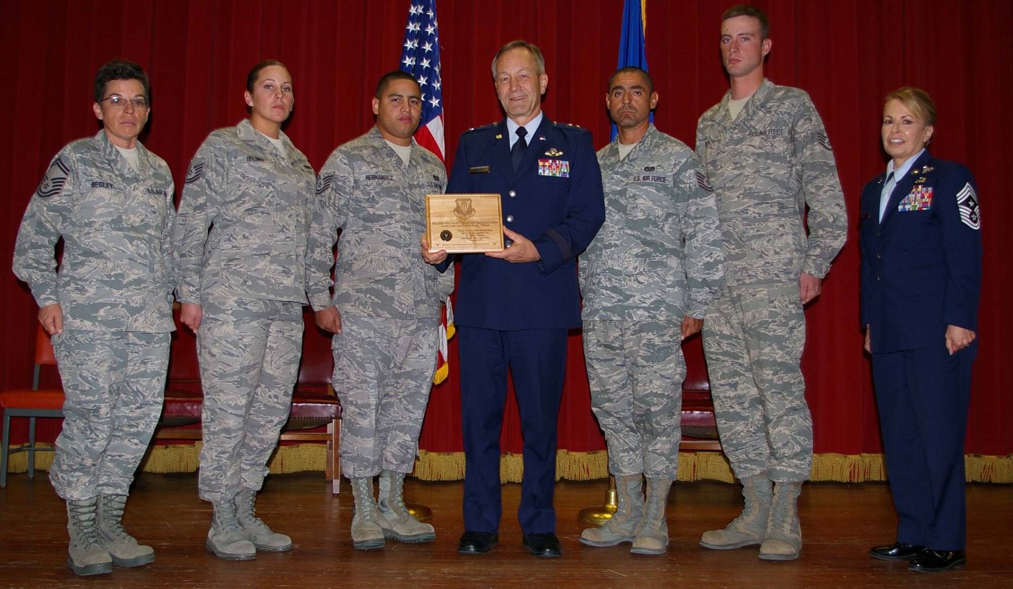 Maj. Gen. Eric W. Crabtree, Commander, 4th Air Force, and Chief Master Sgt. Patricia A. Thornton, 4th Air Force Command Chief Master Sgt.,  present a plaque of appreciation to a group of Military Training Instructors following a Commander's Call, Nov. 7, 2010.  The instructors are from the 433rd Training Squadron, Lackland Air Force Base, Texas, and gave a presentation on proper customs and courtesies, wear of the uniform, and also discussed career opportunities for Reservists to serve as training instructors.